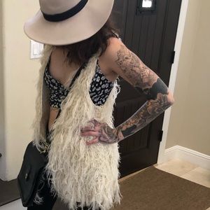 Cream colored sleeveless cardigan